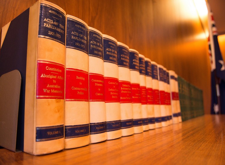 Law volumes on a shelf for lawyer mediator blog