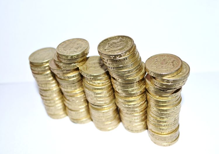 How Much Does Family Mediation Cost? image with stacks of gbp coins in a rowl